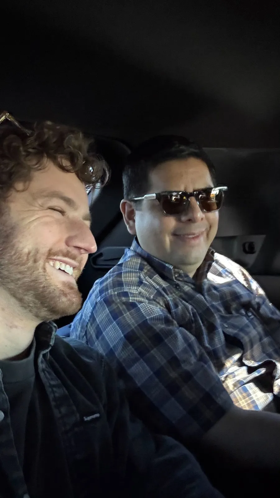 Two teammates laughing together on a CarEdge trip