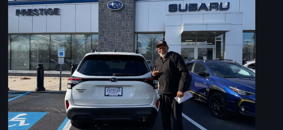 A happy CarEdge buyer with their new 2026 Subaru Forester
