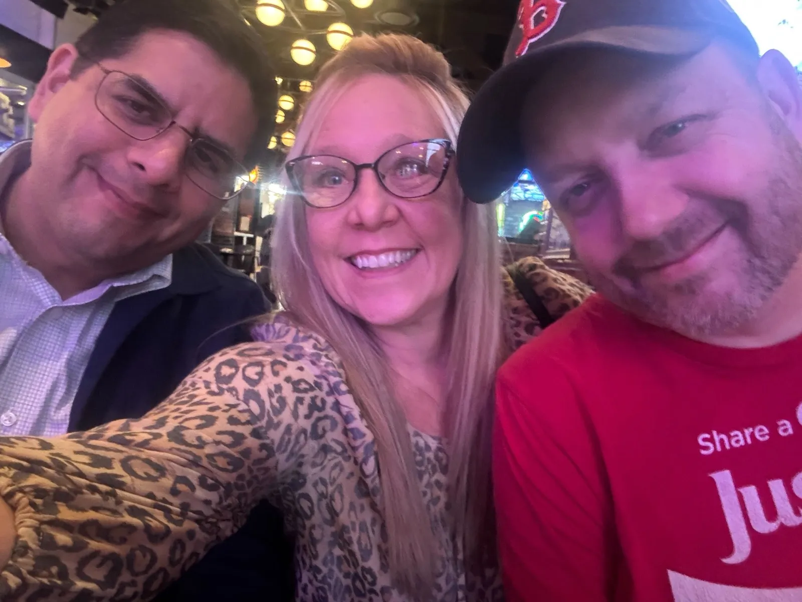 Three CarEdge teammates at a team dinner