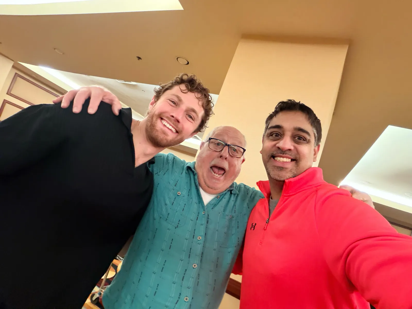 CarEdge co-founder Ray Shefska laughing with two teammates